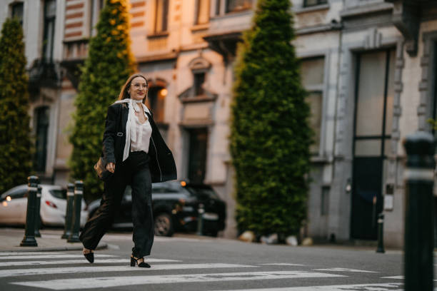 istock Woman walking on pedestrian crossing line 2154244056
