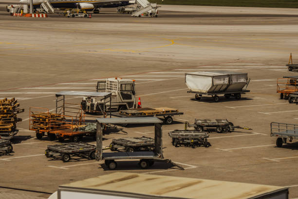 High angle view of busy airport view with airplanes and service vehicles on overcast day without people