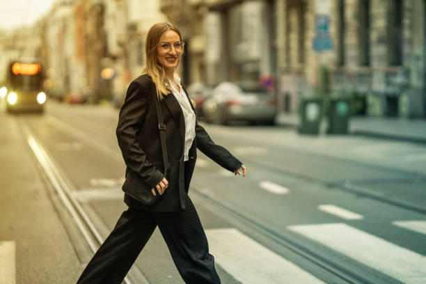 istock Woman walking on pedestrian crossing line 2154244102