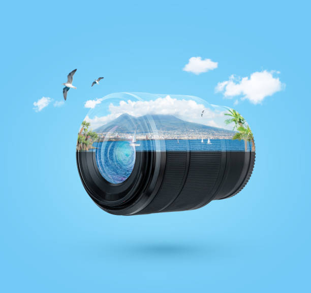 Camera lens flying on blue background with beautiful sea view inside.