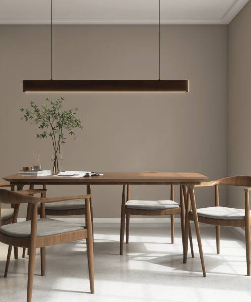 istock Modern, minimal brown wooden dining table, chairs, pendant light and tree in sunlight from window on luxury beige wall dining room 2154249061