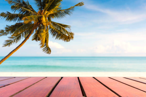 istock Empty wooden table, coconut tree on the beach. summer background for place product and advertising 2154249801