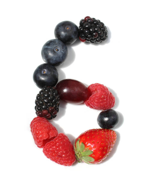 istock number 6 from raspberry, blackberry, strawberry with green leaf, blueberries, grape. isolated berries numbers for party 2154250183