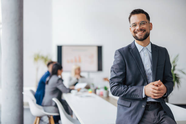 istock Warmly smiling businesswoman leading team 2154250667