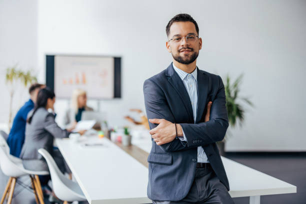 istock Smiling director in modern office space 2154250673
