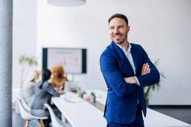 istock Business professional in blue suit arms crossed 2154250926