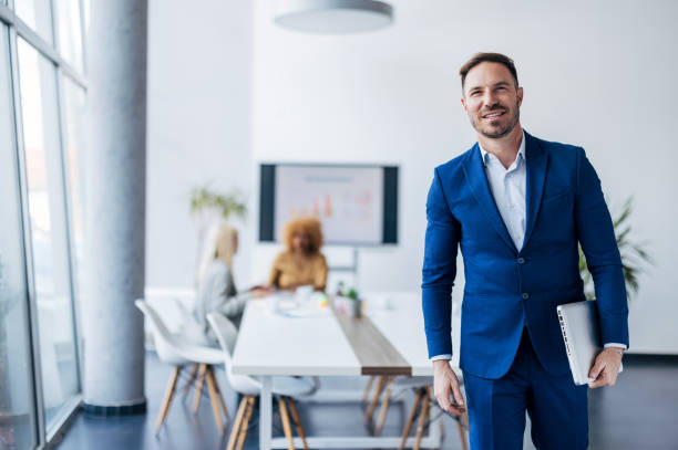istock Professional with confident stance in front of meeting 2154251479