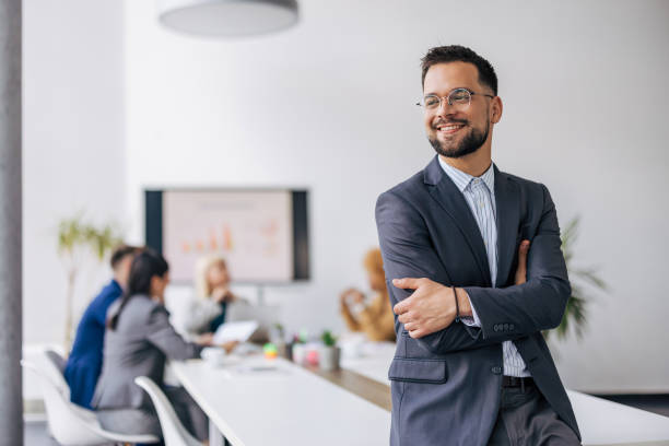 istock Confident business leader by team 2154251529