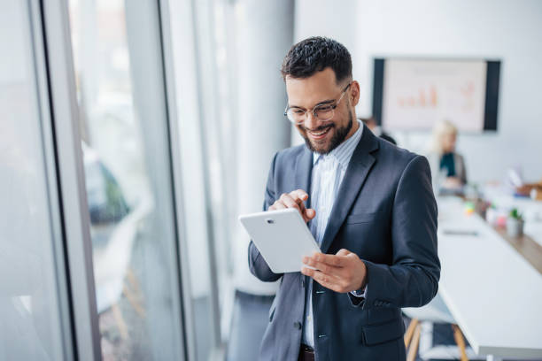 istock Businessman with tablet in office 2154251594