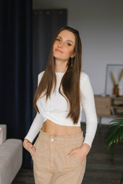 istock Young beautiful woman standing at home 2154255108