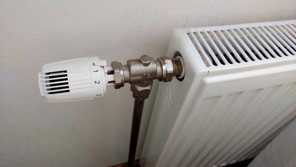 istock White radiator in the apartment 2154255834