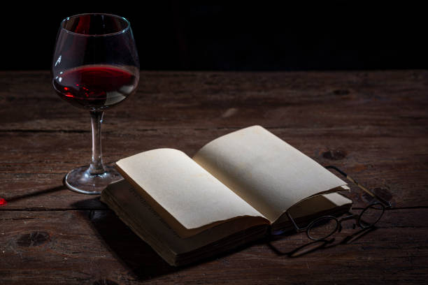 Coffee backgrounds: coffee cup on wooden table with book