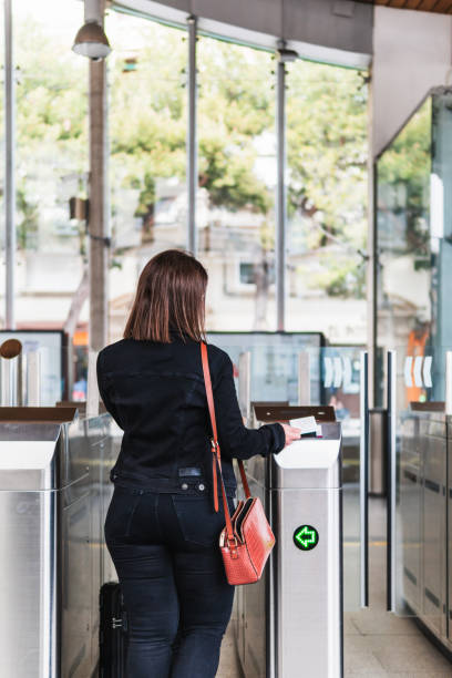 istock Woman validating public transport ticket 2154257255