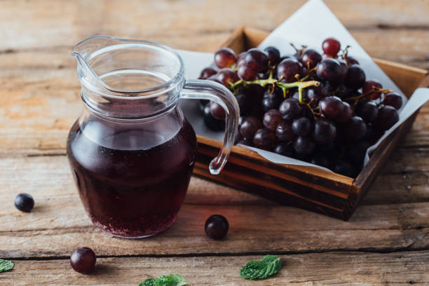 istock Grapes in wooden basket 2154257408