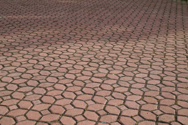Coating with modern textured paving tiles of square shape