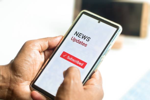 istock Digital newspaper and magazine subscription plan concept. Man  decided to subscribe, close up view of mobile phone. 2154259317