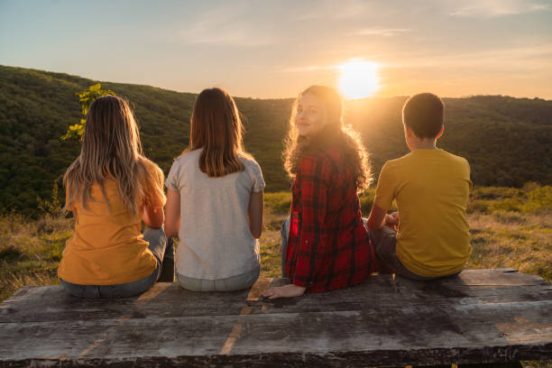 istock Group of children during sunset in nature 2154262475