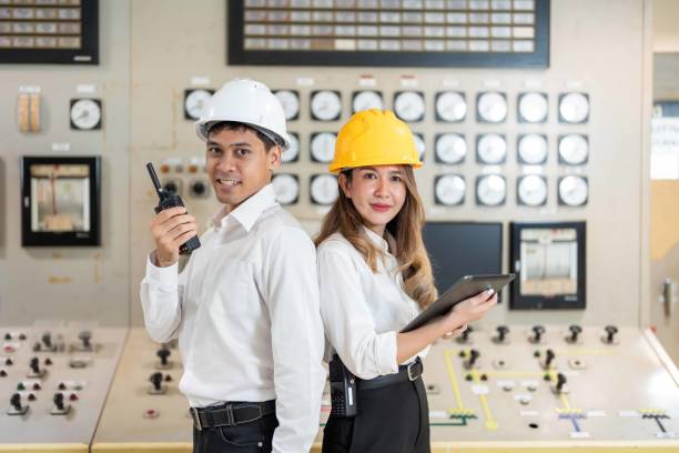istock Focused and determined within the industrial landscape, two Asian engineers collaborate at the power plant, their laptops essential tools in their mission for clean and sustainable energy production. 2154264231