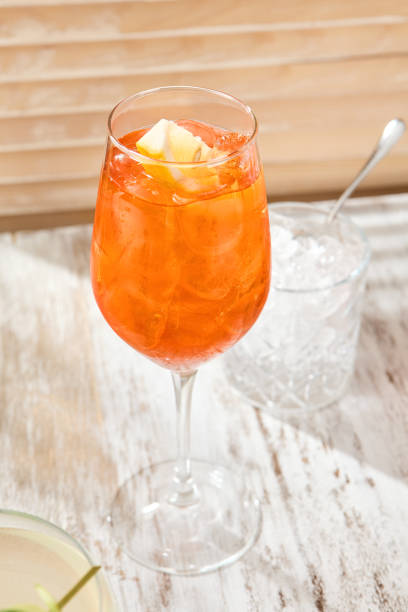 istock Refreshing Spritz Cocktail Enjoyed at a Rustic Wooden Table, Perfect Drink for a Summer Day 2154265719