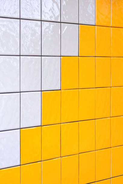 istock White and yellow ceramic interior tile wall decoration background in living room, perspective side view and vertical frame 2154266565