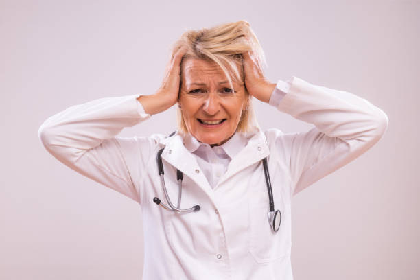 istock Overworked mature female doctor screaming 2154267988