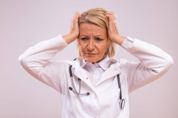 istock Overworked mature female doctor 2154267989
