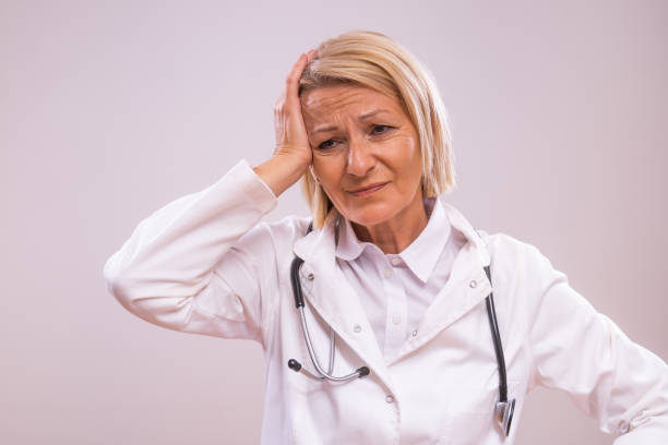 istock Tired mature female  doctor 2154268000