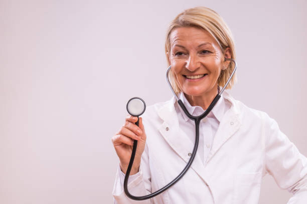 istock Mature female doctor with stethoscope 2154268030