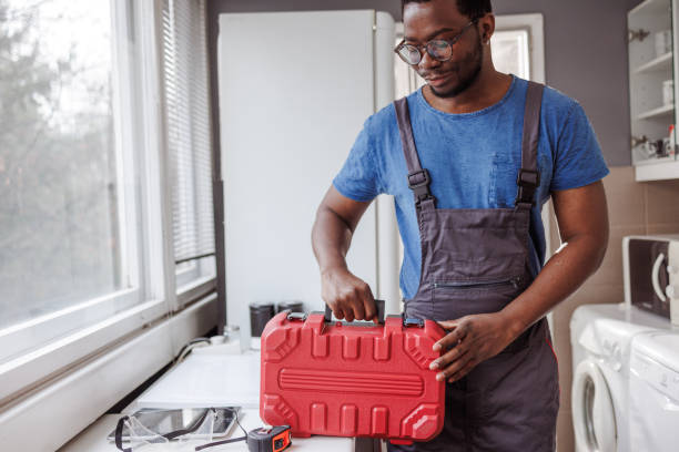 istock African American handyman holding a toolbox 2154268632