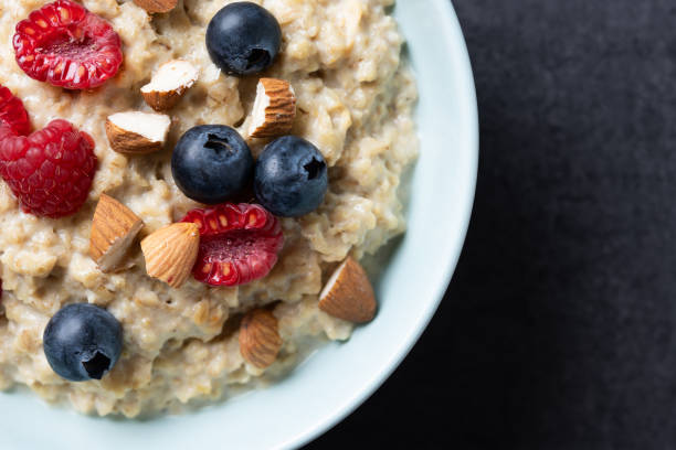 istock Oatmeal porridge with fruit and berries,almonds 2154269910