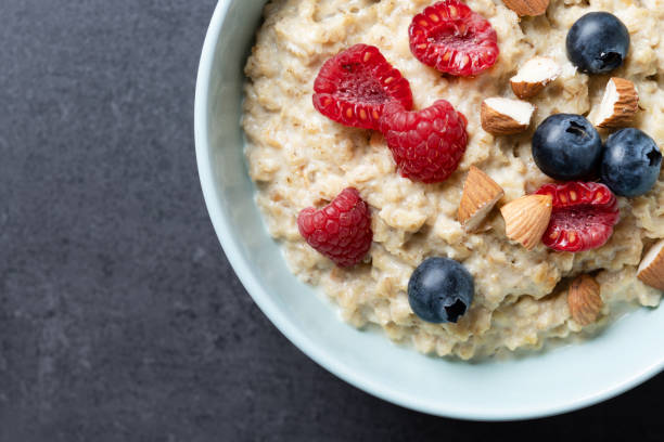 istock Oatmeal porridge with fruit and berries,almonds 2154269924