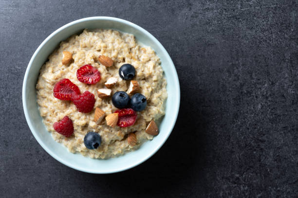 istock Oatmeal porridge with fruit and berries,almonds 2154269939