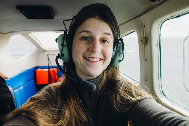 istock Happy Woman Making Selfie in Cockpit Flying in Small Airplane 2154270848