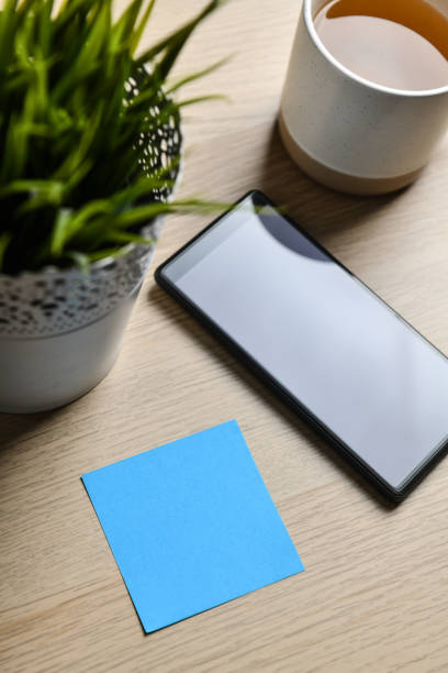 Blue Note Serving As A Reminder To Drink Tea And Use Smartphone For Work