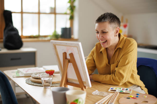 istock Woman painting at home 2154273393