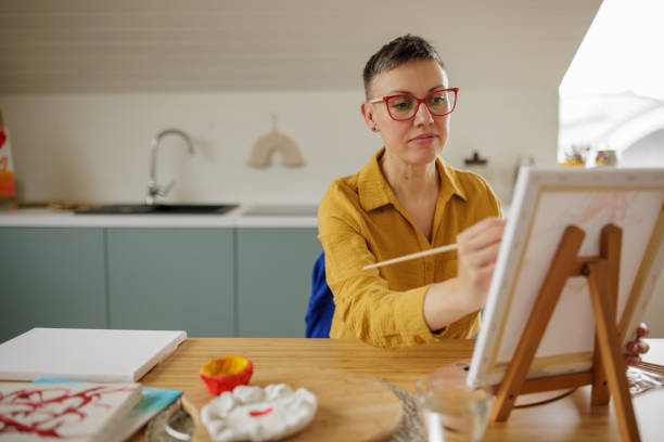 istock Woman painting at home 2154273394