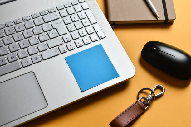 istock Sticky Note Serving As A Reminder For Compliance On Laptop With Notebook And Mouse 2154273455