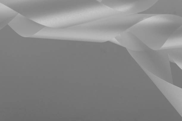 istock Abstract background of white satin ribbons 2154274347