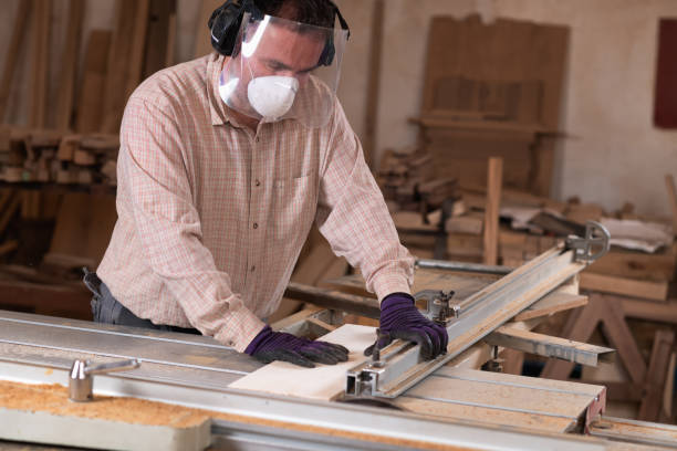 istock Skilled cabinetmaker using rotary saw, wearing eye and face protection 2154277609