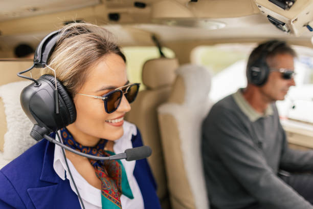 istock Stewardess and  pilot sitting in a cockpit 2154278934