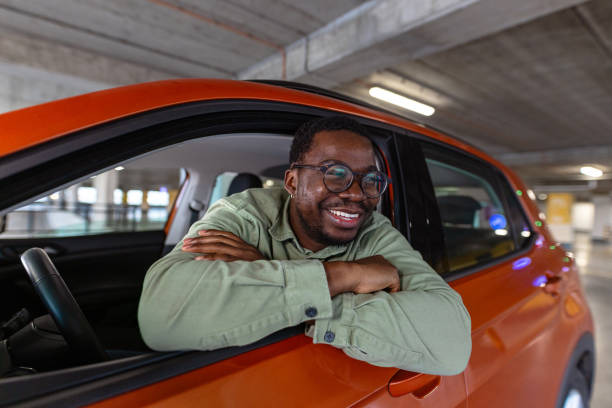 istock An urban smiling man in the car 2154279209