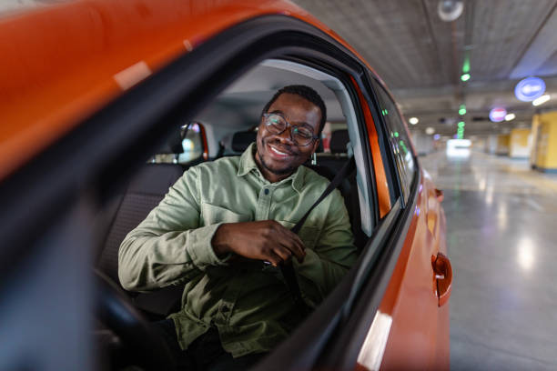 istock Young African American man starting a car ride 2154279219