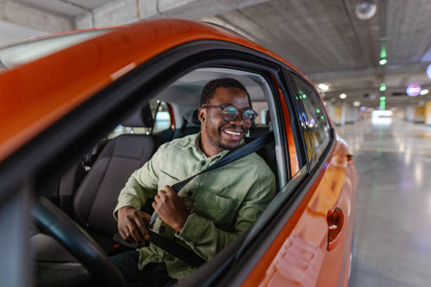 istock Safety first! A Black man is fastening a seat belt. 2154279225