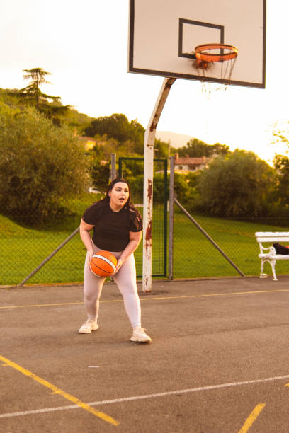 istock Playing basketball in my free time with boys 2154280109