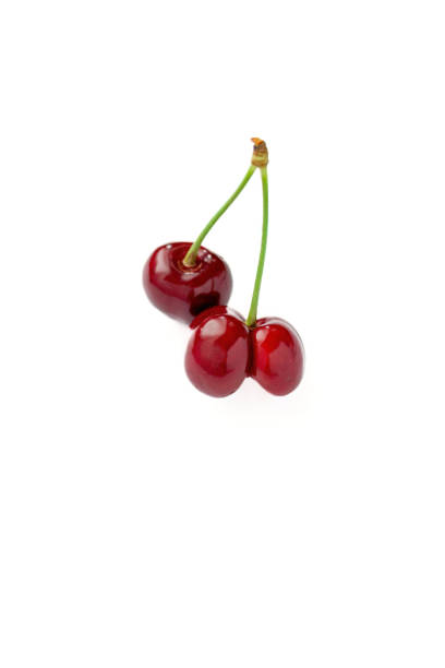 istock Close-up of  fresh red heart shape cherryes with white background. 2154281311