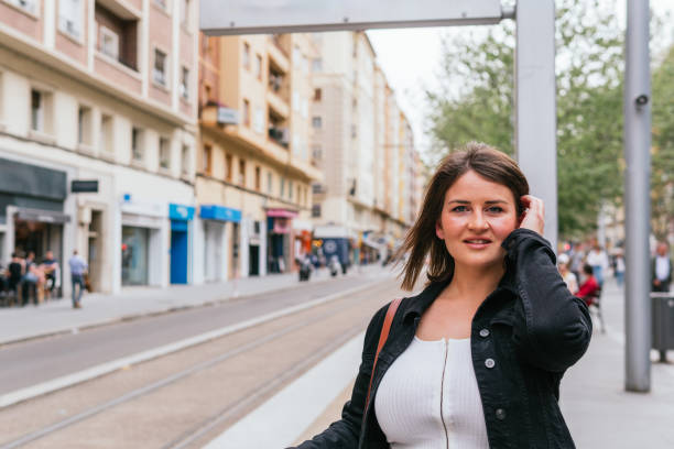 istock A woman waiting for urban transport 2154282776