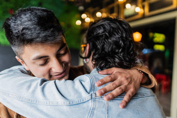 istock Friends embracing at the restaurant 2154283076