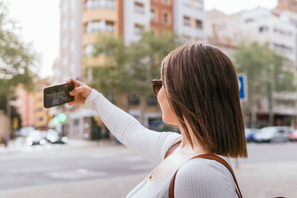 istock Tourist taking a selfie visiting the city 2154284232