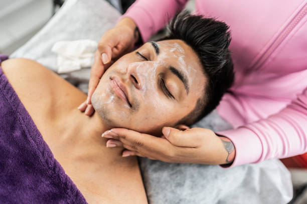 istock Young man receiving face massage in spa 2154284308