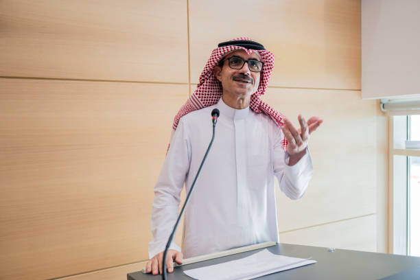 istock Smiling Saudi educator speaking in university lecture hall 2154284431